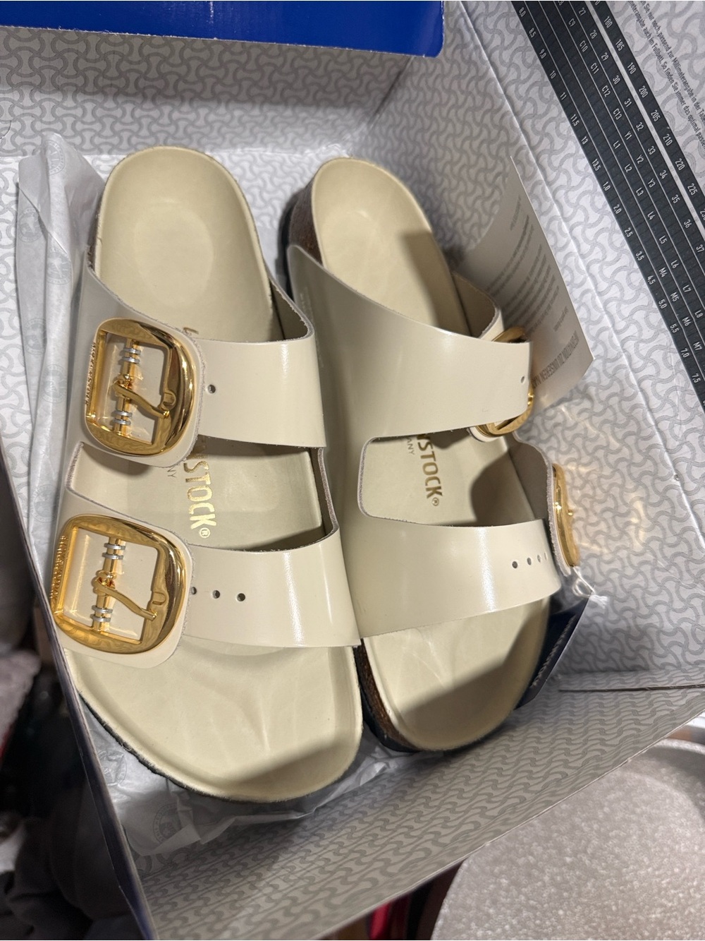 Birkenstock Cream Patent Arizona Sandals with Gold Buckles
